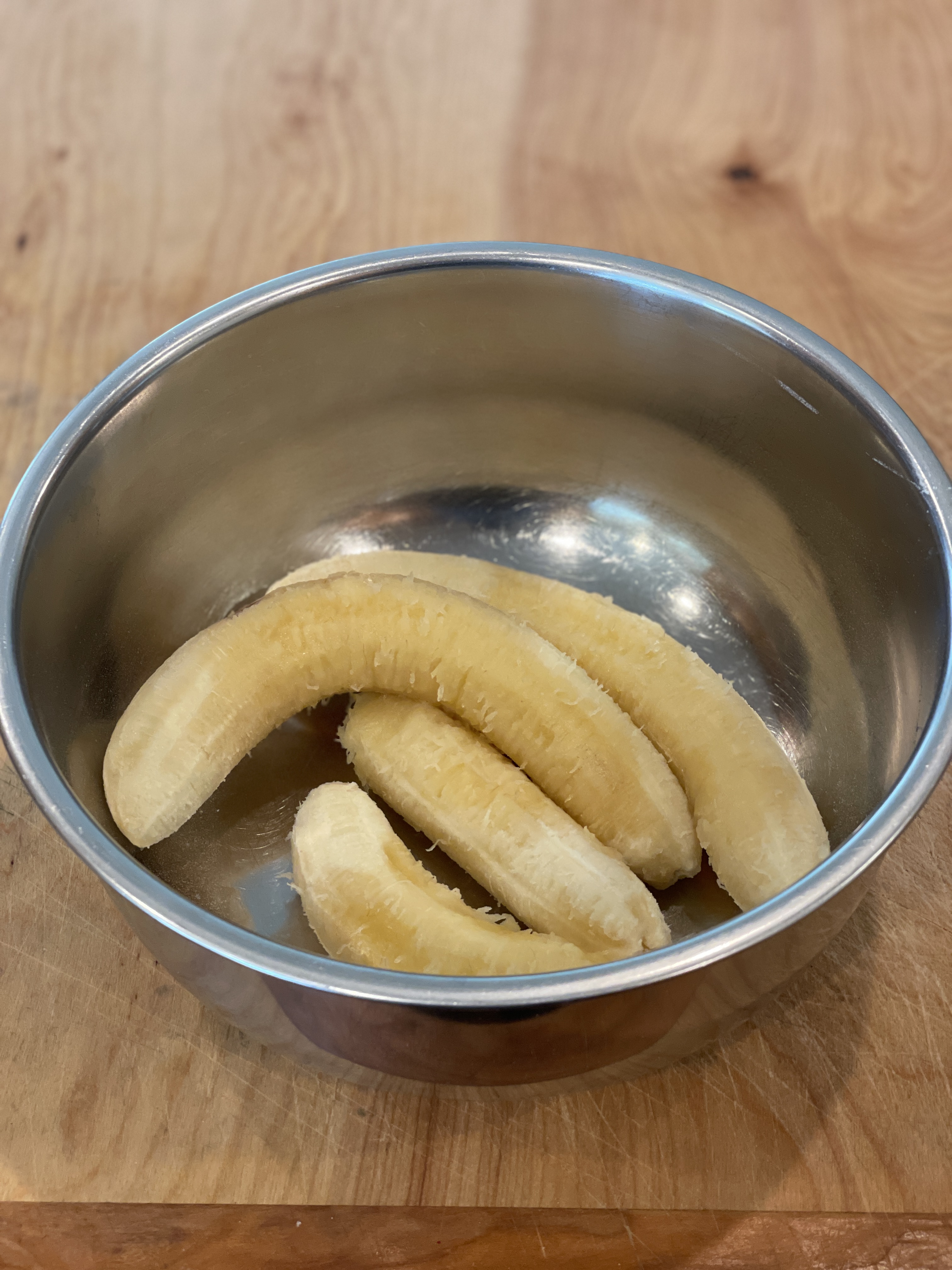 Peeled bananas in a mixing bowl